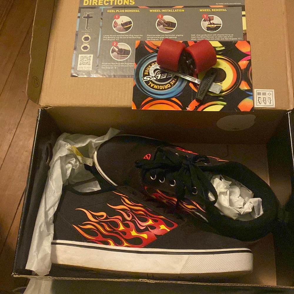 Like new Heelys in box.